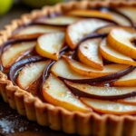découvrez la recette facile et rapide de la tarte poire chocolat amande de cyril lignac, un dessert gourmand alliant saveurs fruitées et gourmandise chocolatée.